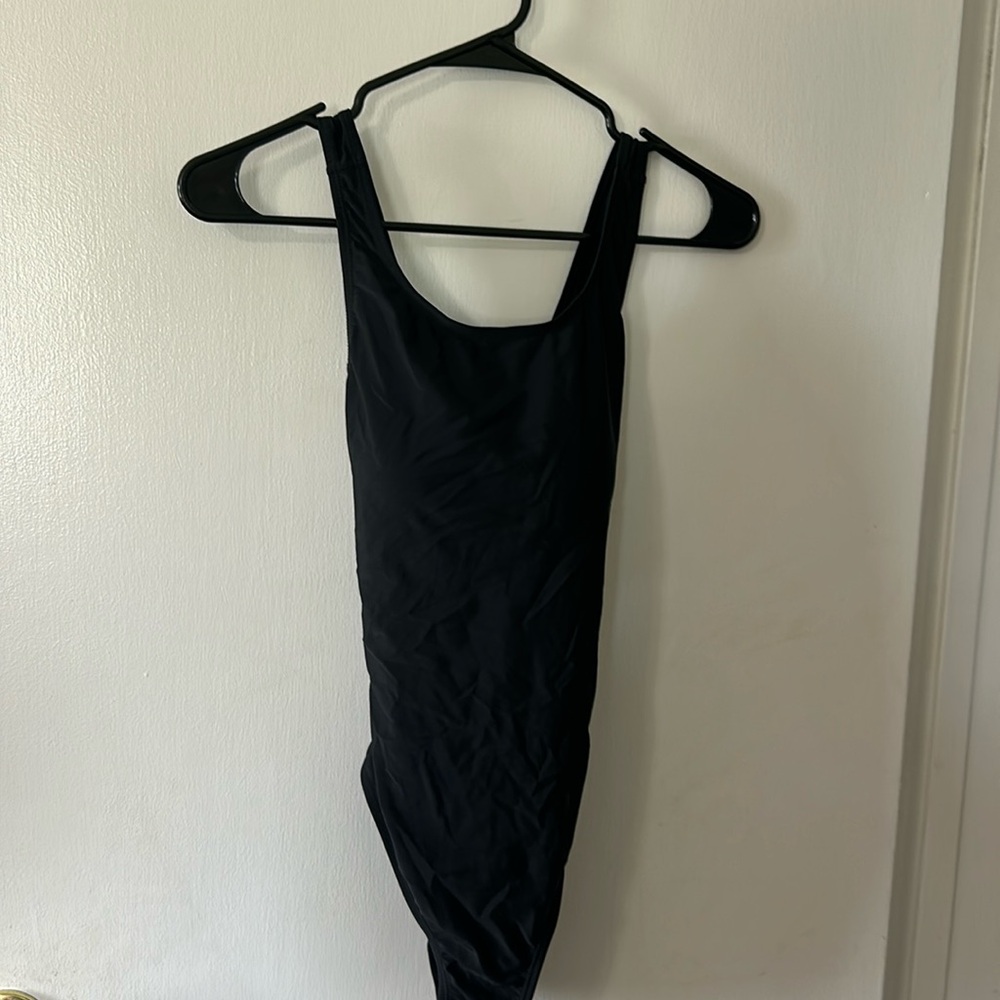 Size small black one piece bathing suit. Back is crisscrossed.